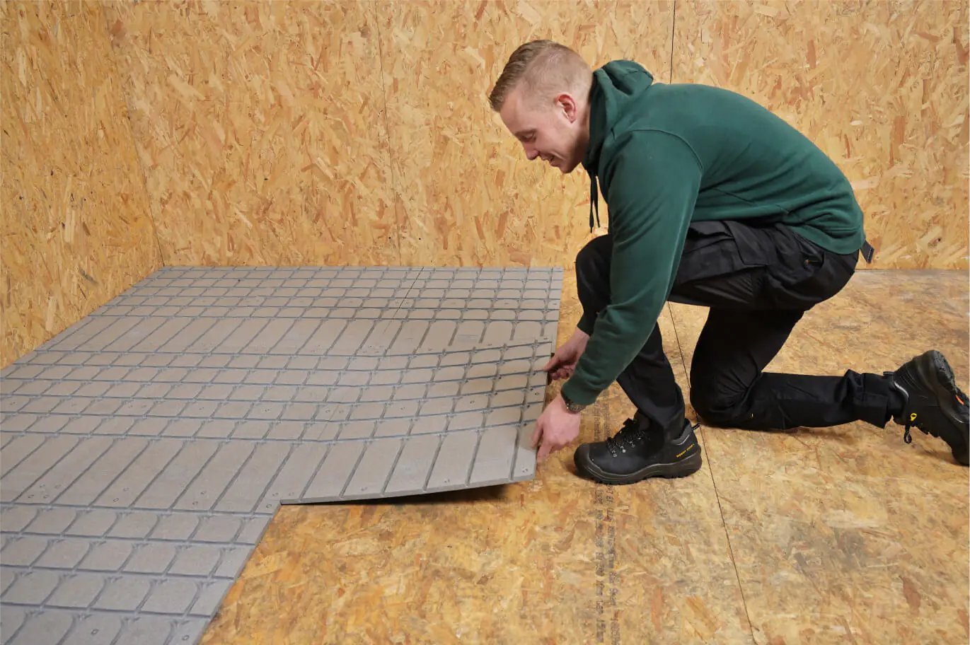The installer is laying down the EPS Insulation.